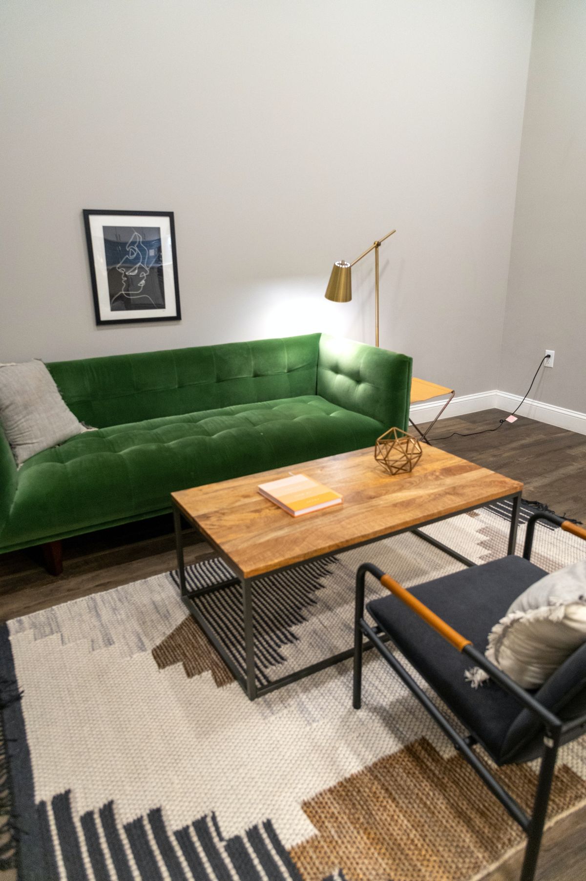 Rug beneath a table and in front of a sofa