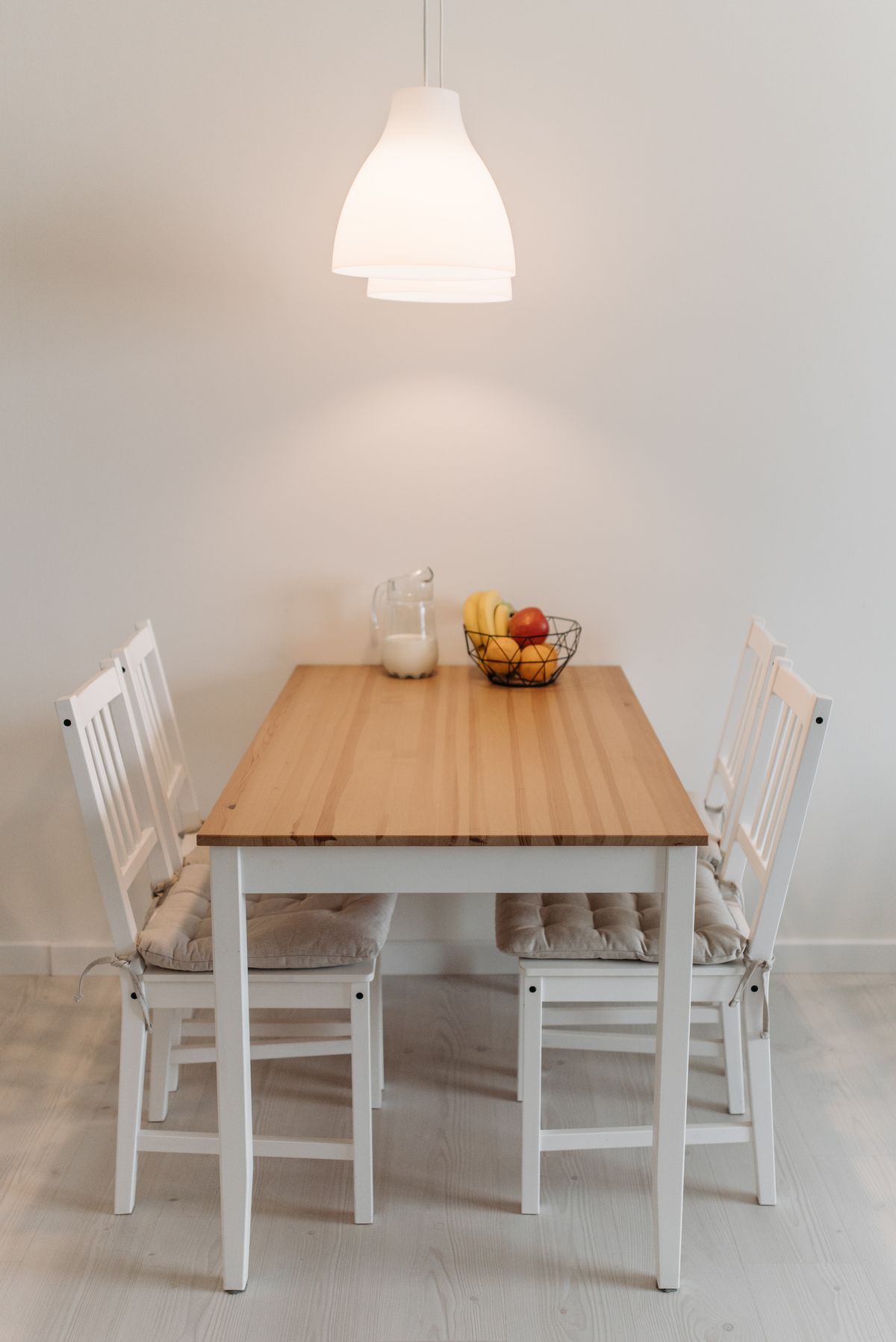 Pendant lamp positioned above a dining table