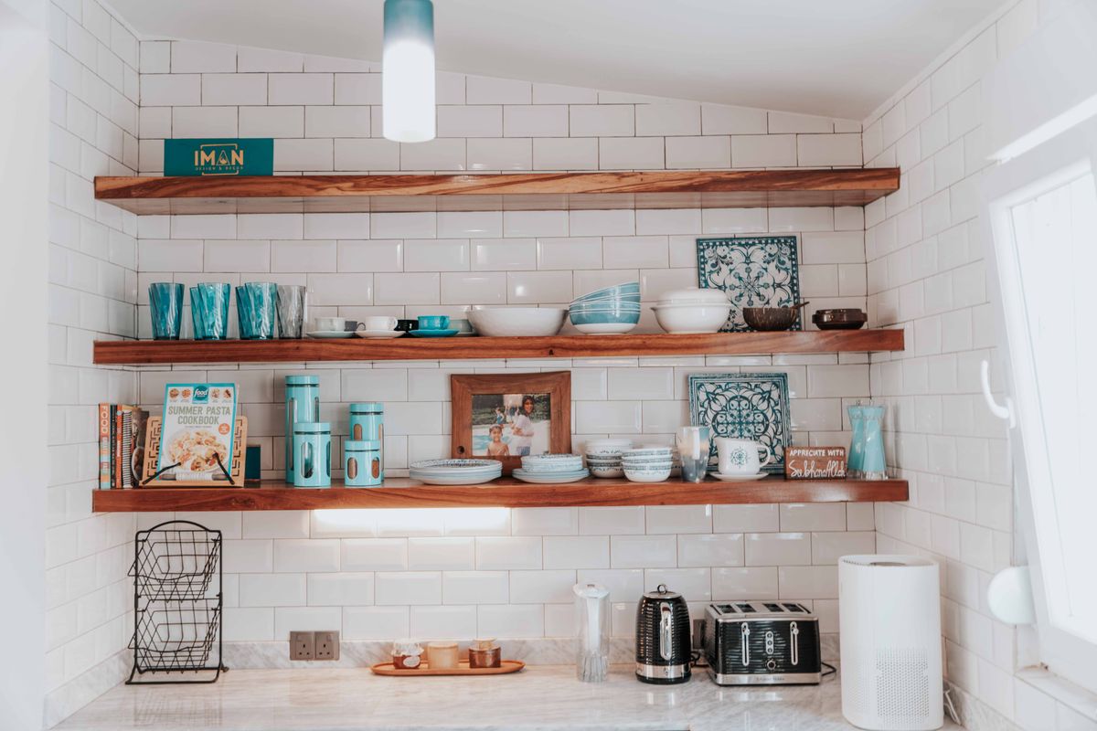 Open kitchen shelves displaying tableware