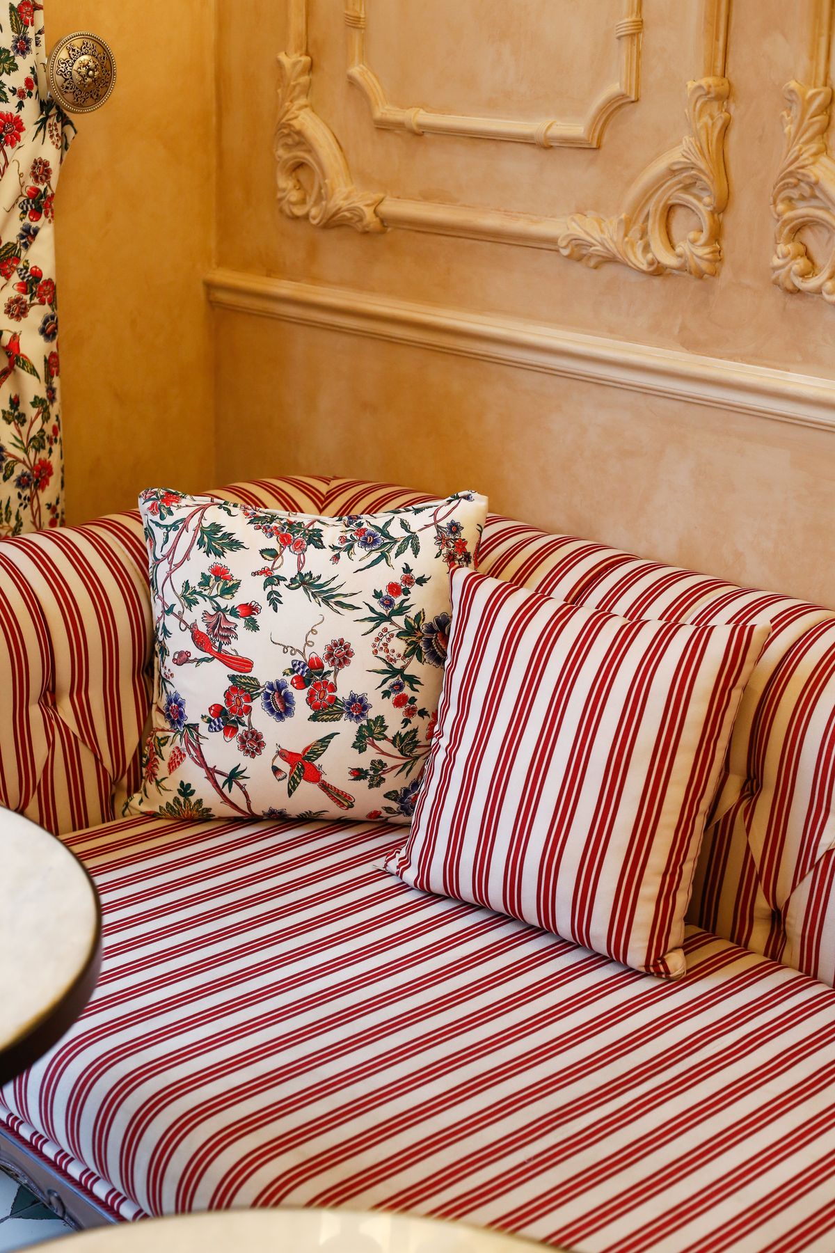 Striped sofa with patterned cushions