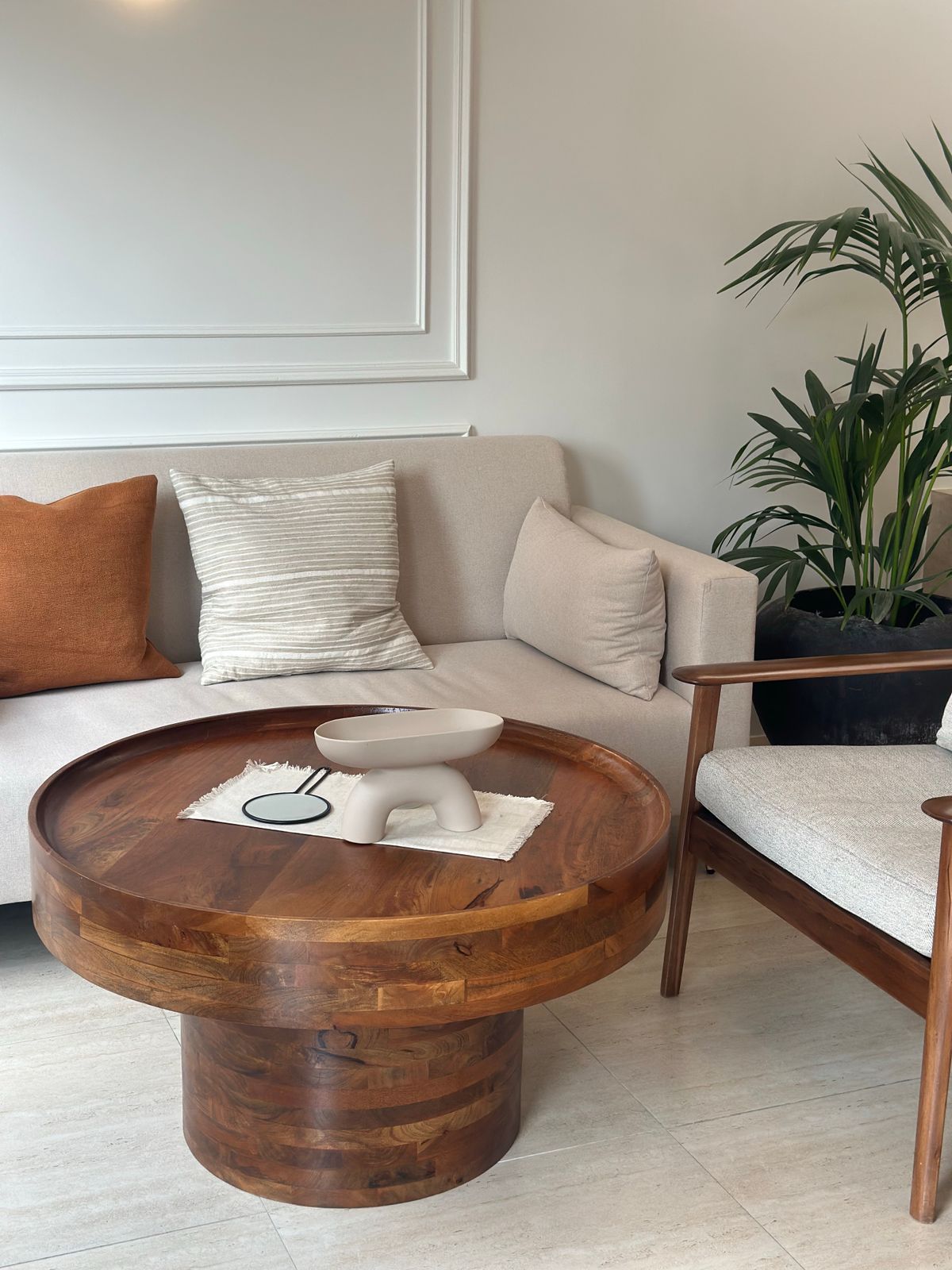 Wooden coffee table in front of a sofa