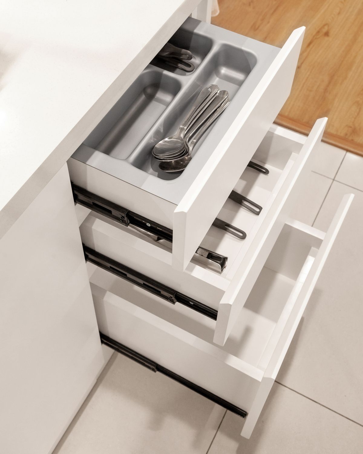 Cutlery organiser inside a kitchen drawer