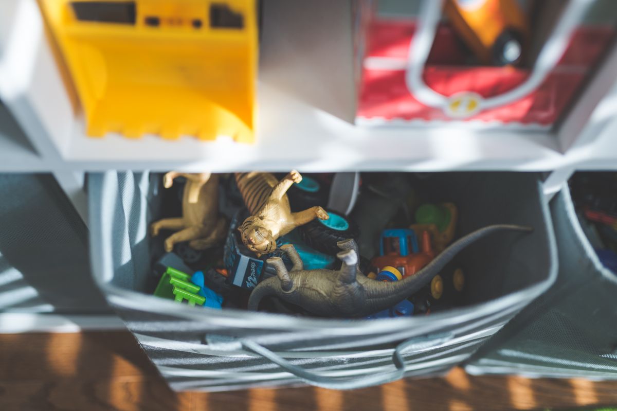 Small toys in a clear storage box