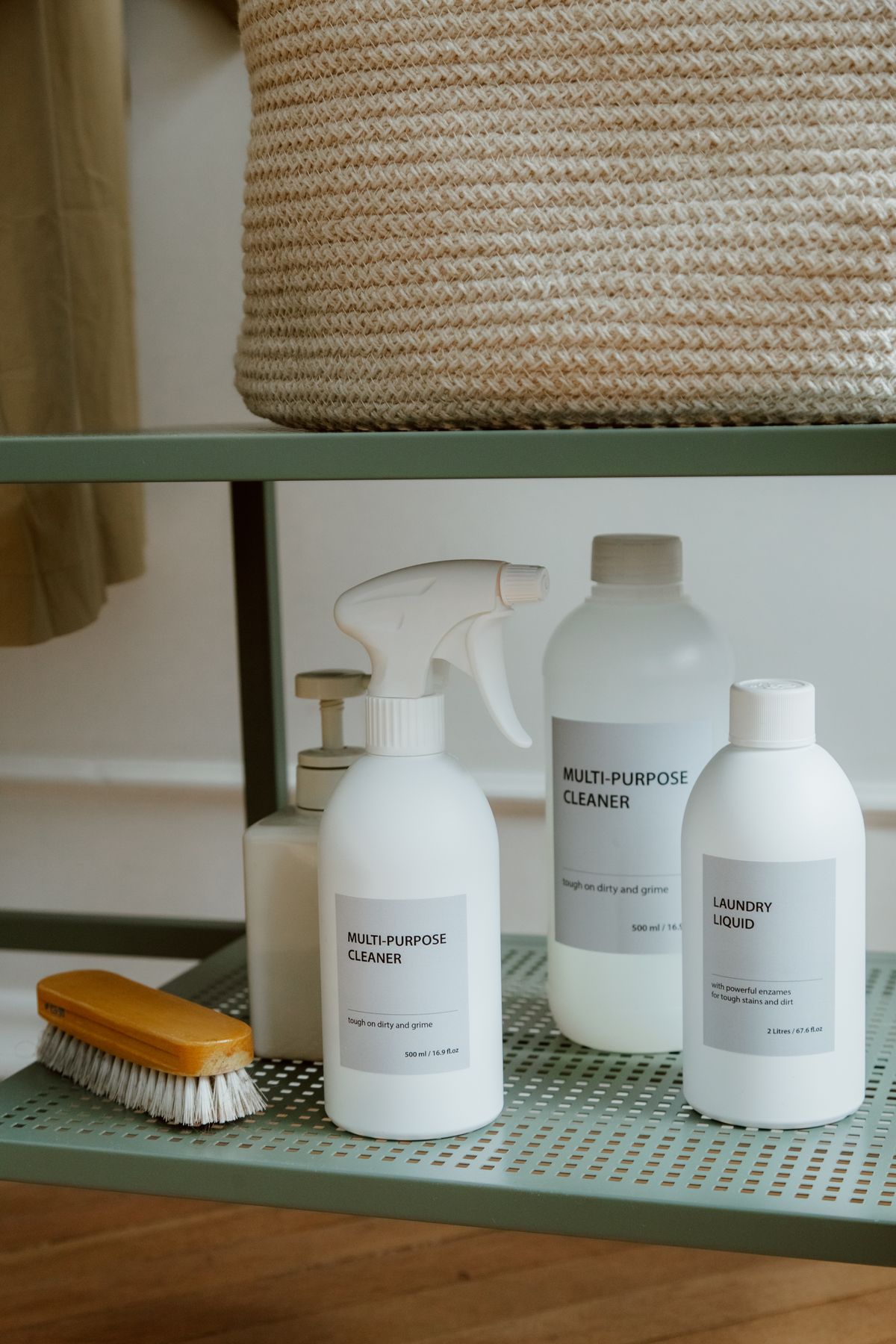Brush and cleaning products on a shelf