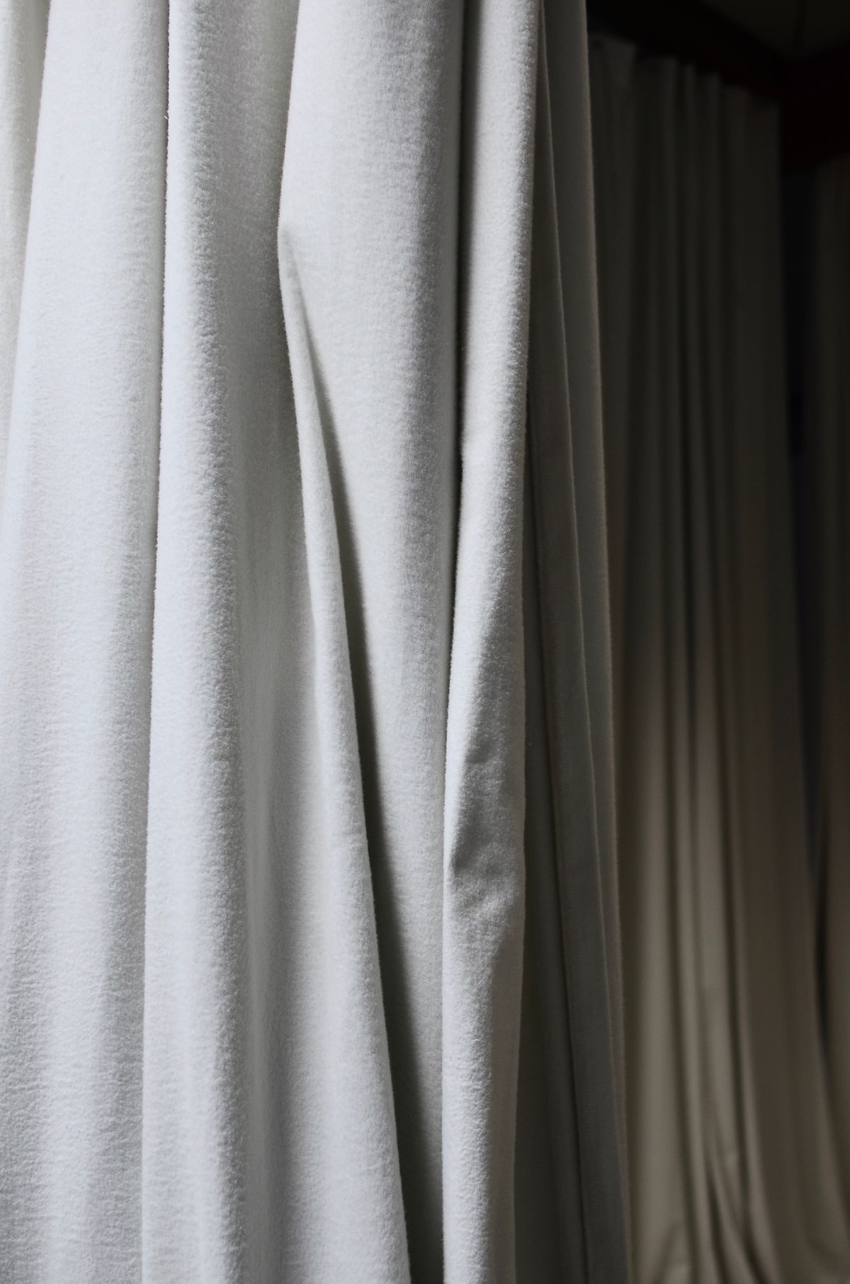 Folds in white curtain fabric