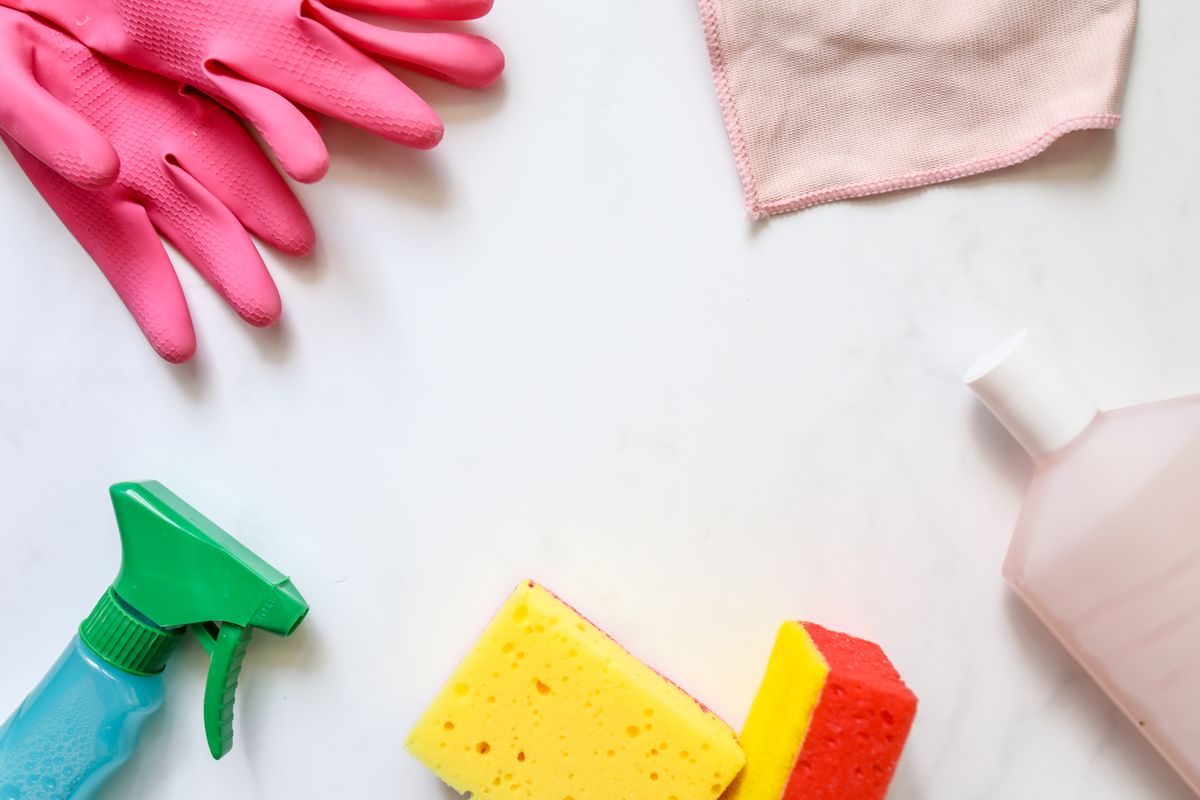 Gloves, sponges and a cleaning spray bottle