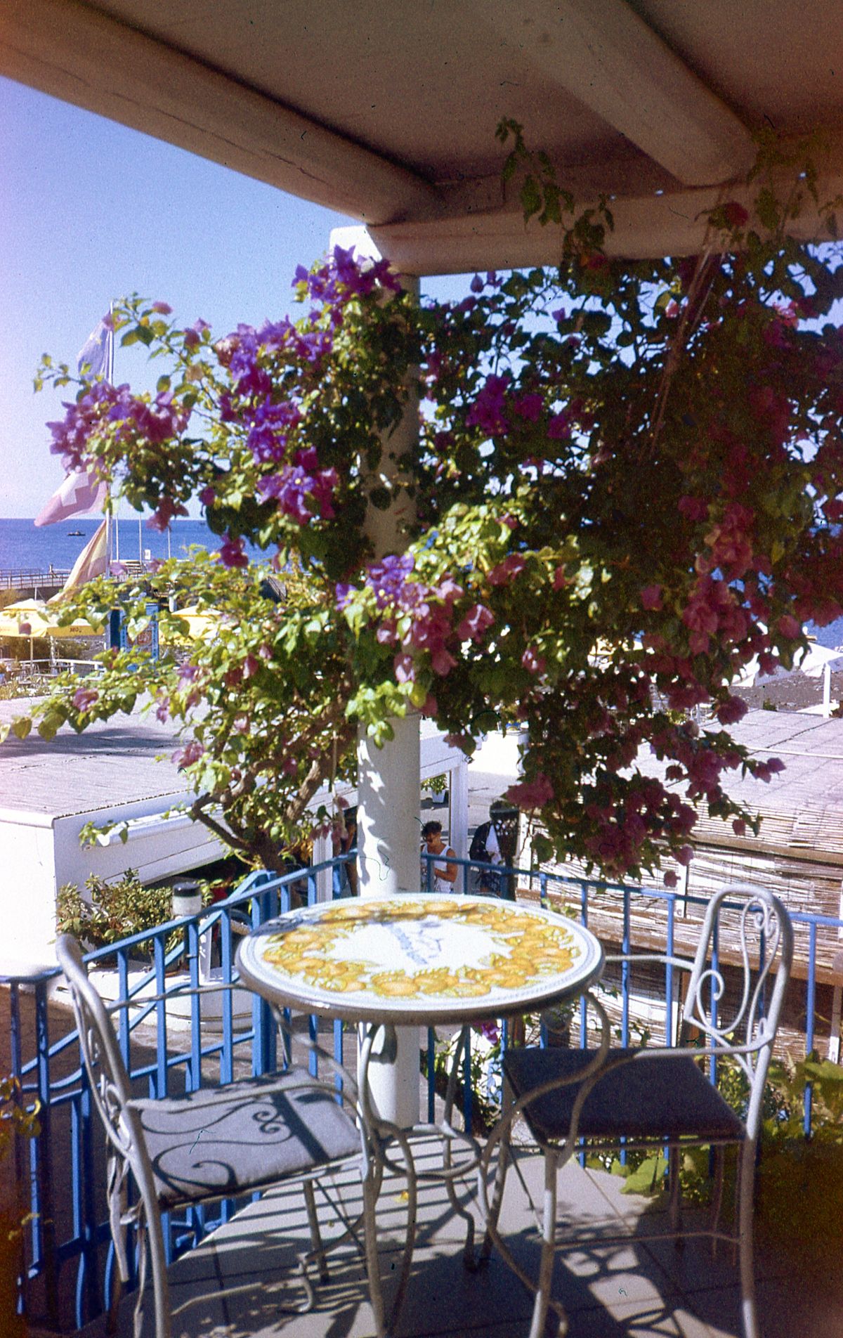 Round table and two chairs on a narrow balcony