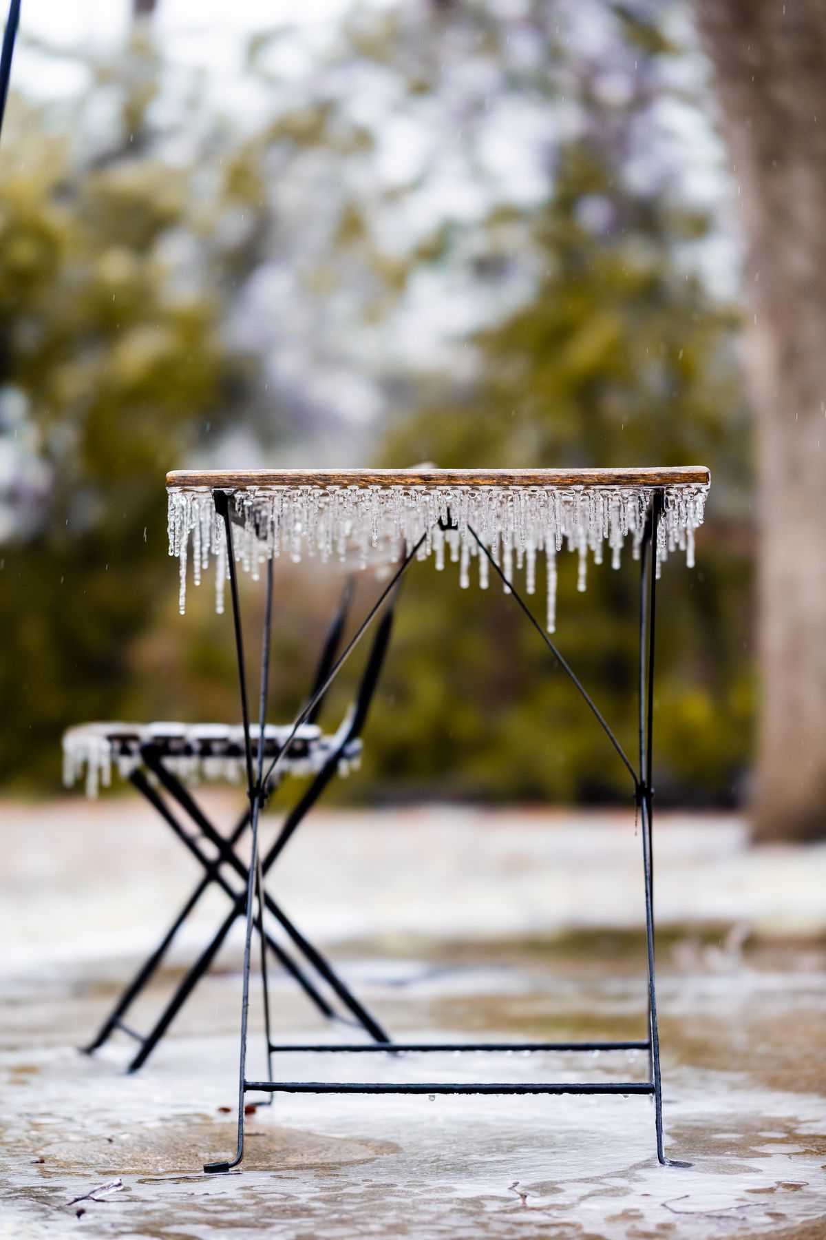 Outdoor furniture covered in ice