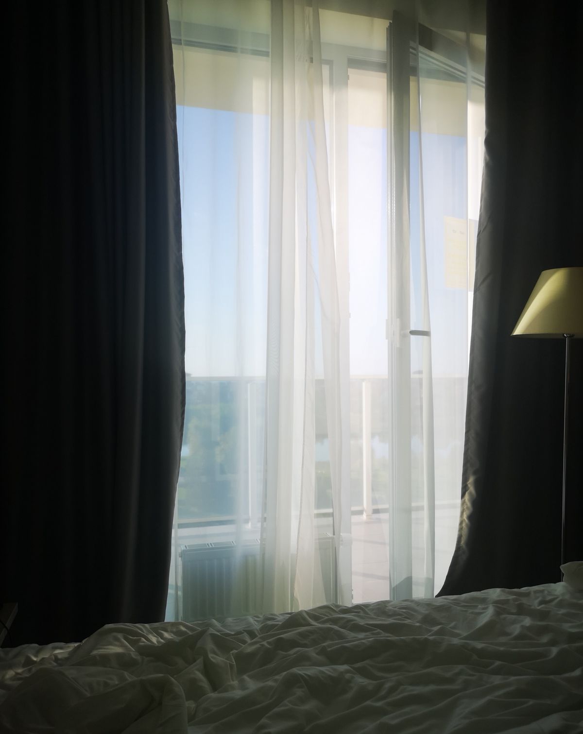 Heavy curtains and sheer fabric in front of a window