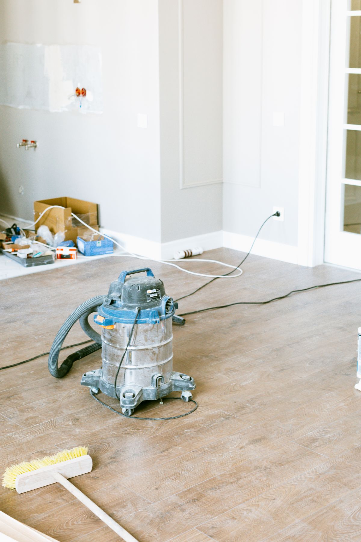 Canister vacuum on a room floor
