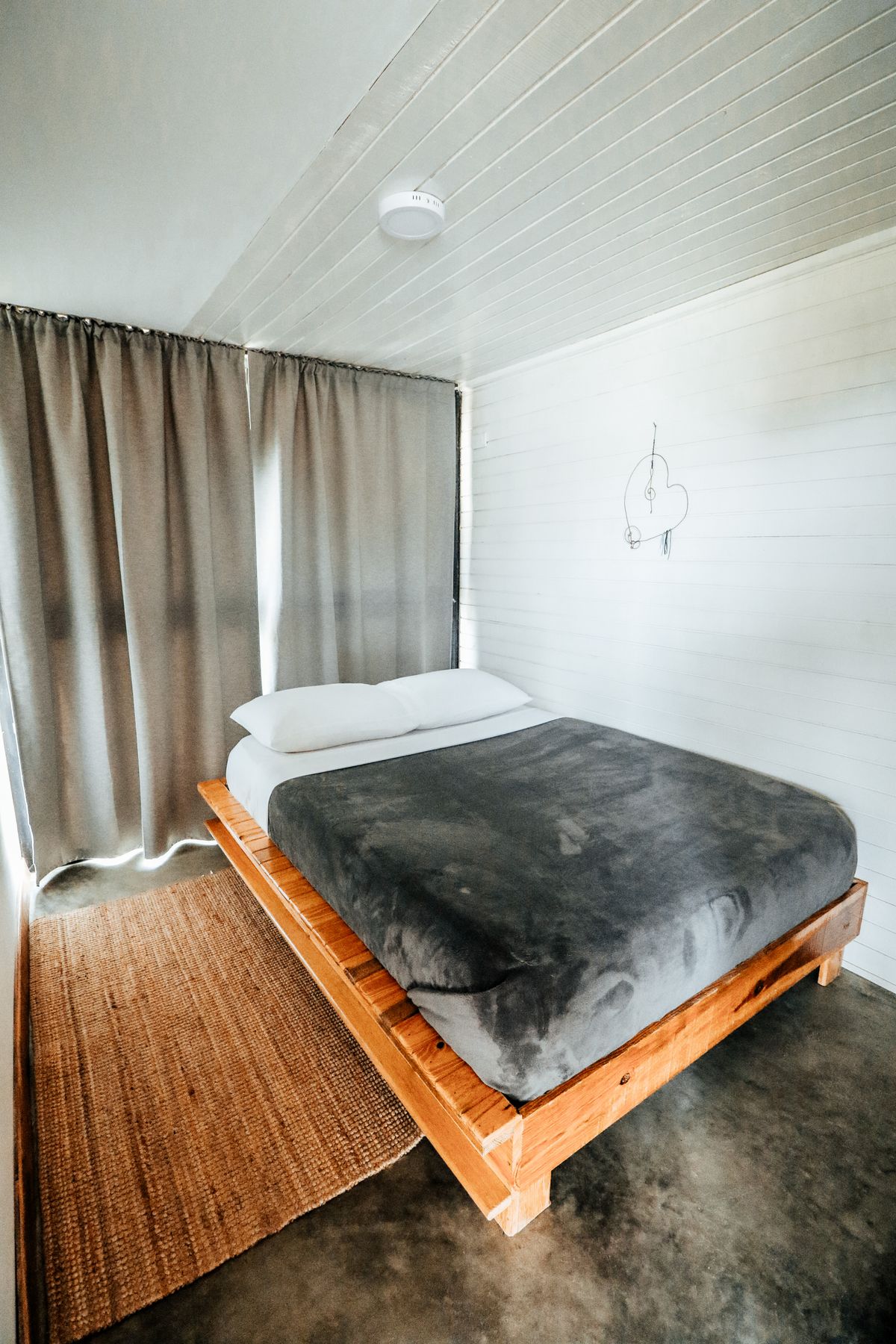 Bed with a visible wooden frame