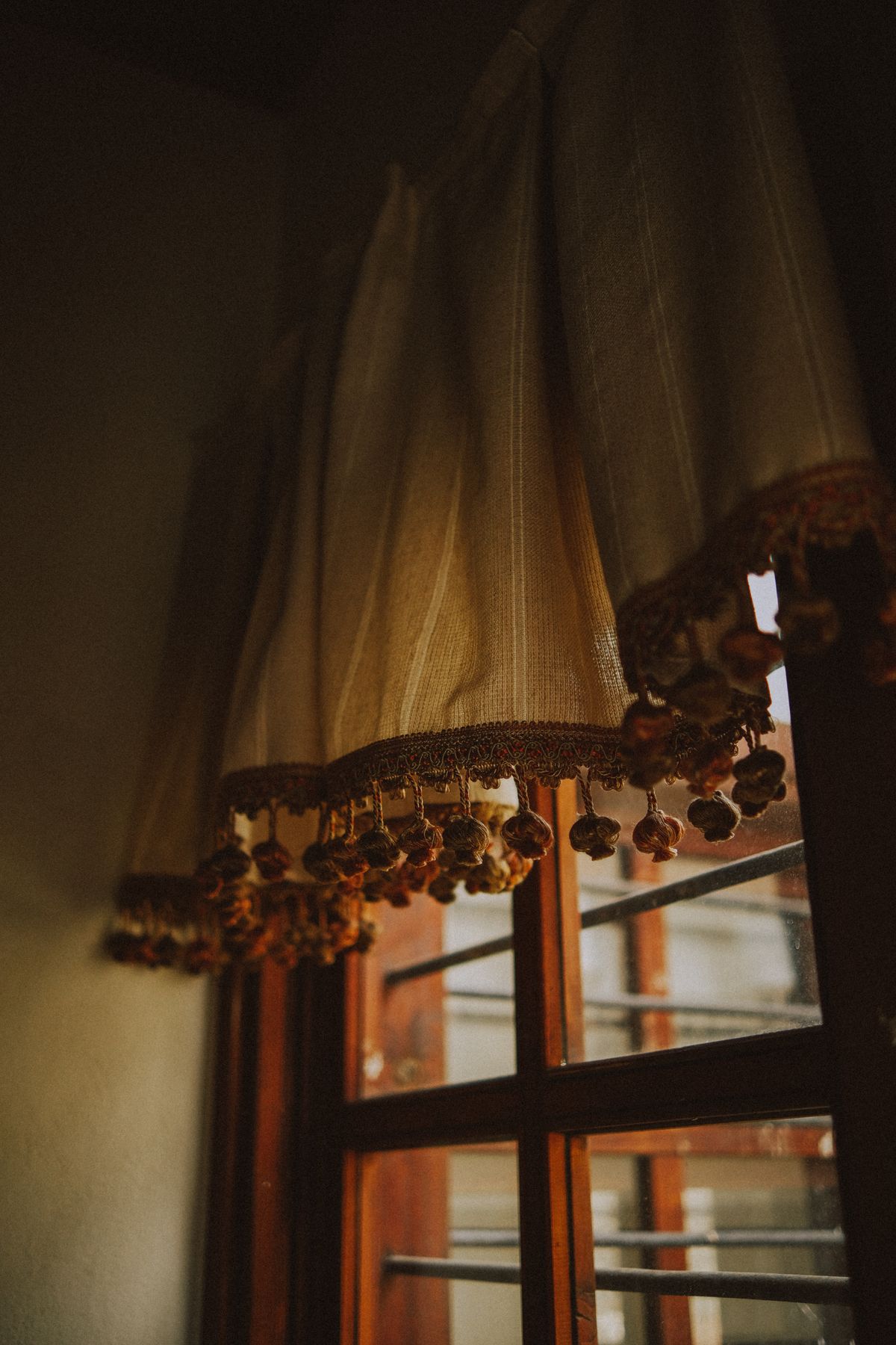 Curtain folds beside a window